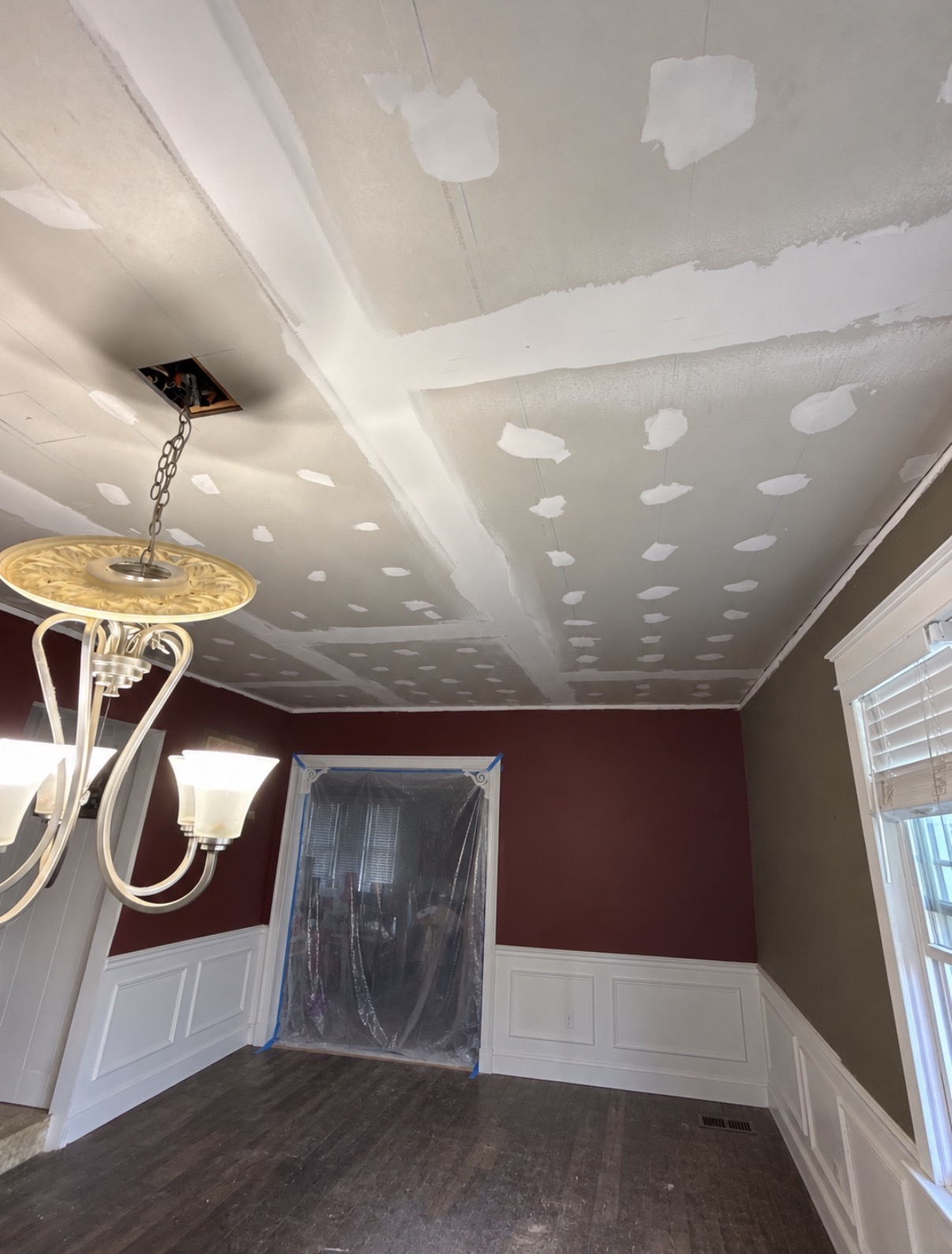 Ceiling drywall seams and fasteners patched during finishing