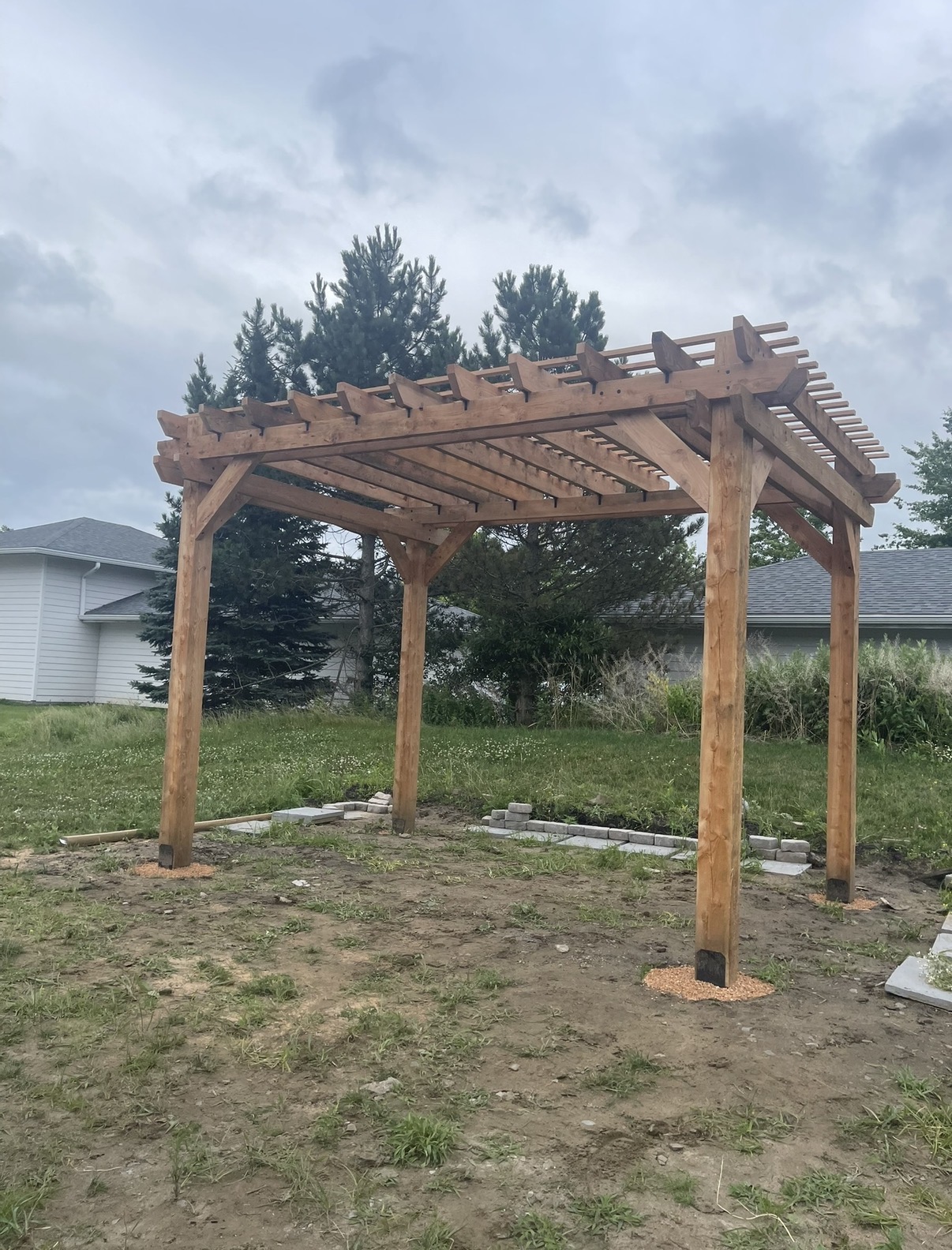Freestanding timber pergola in a backyard