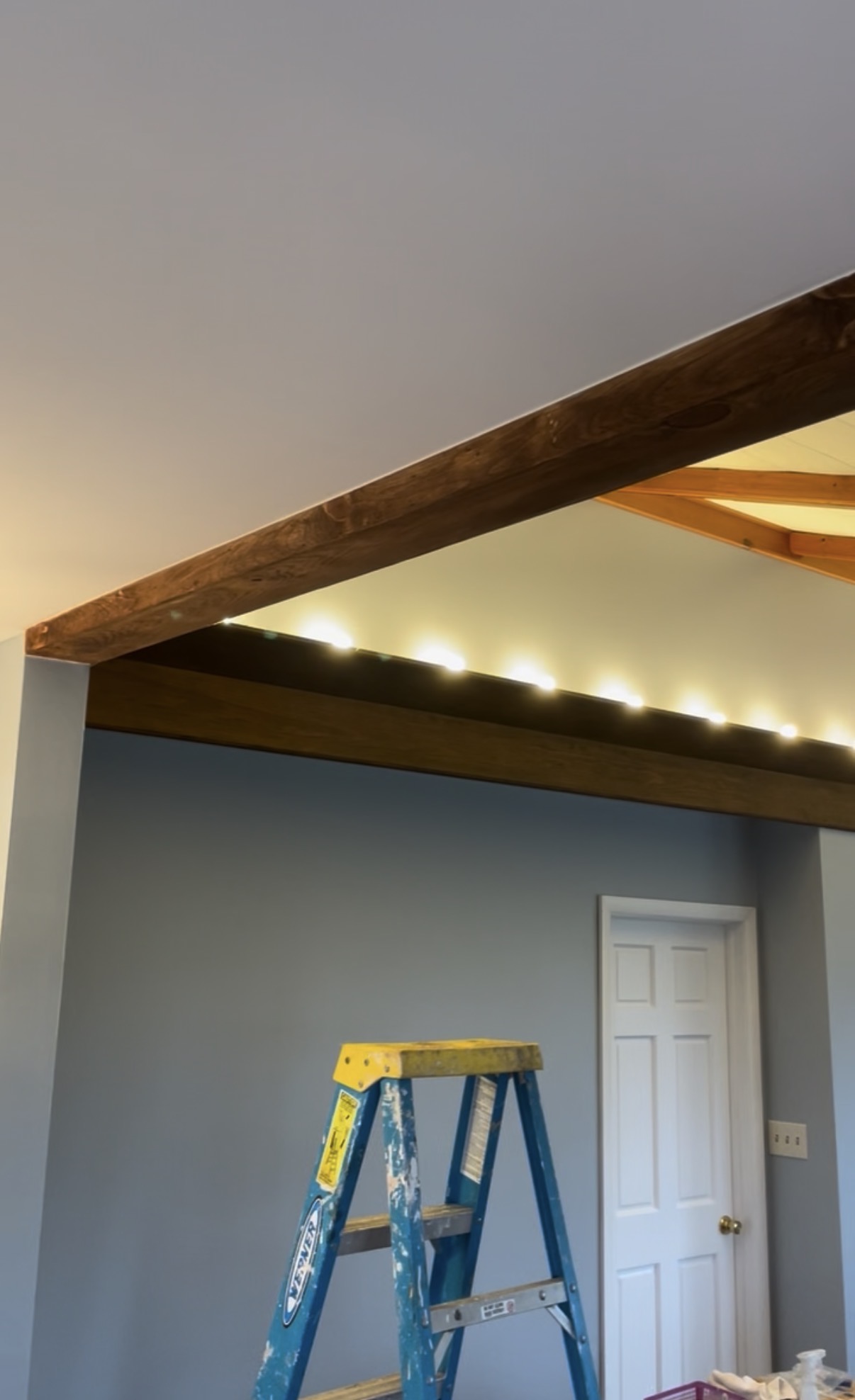 Wood beams and trim around an interior opening